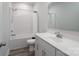 Clean bathroom features a bathtub with shower, a modern vanity and a large mirror at 2890 Westshore Pl, Denver, NC 28037