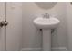 Bathroom featuring a pedestal sink, and modern fixtures at 2890 Westshore Pl, Denver, NC 28037