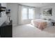 This bedroom offers natural light and decorative shelving to showcase your treasured collectibles at 2890 Westshore Pl, Denver, NC 28037