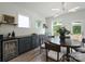 Dining area featuring modern cabinets, countertop, and hardwood floors at 2890 Westshore Pl, Denver, NC 28037