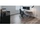 Well-lit home office featuring a modern desk, comfortable chair, and functional storage solutions at 2890 Westshore Pl, Denver, NC 28037