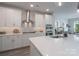 Modern kitchen with a center island, stainless steel appliances, and white cabinets at 2890 Westshore Pl, Denver, NC 28037