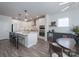 Open concept kitchen with a center island, stainless appliances, and dining area at 2890 Westshore Pl, Denver, NC 28037