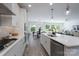 Kitchen featuring a center island, stainless steel appliances, and hardwood flooring at 2890 Westshore Pl, Denver, NC 28037