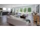 Bright living room with modern furniture, large windows, and hardwood flooring at 2890 Westshore Pl, Denver, NC 28037