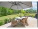 Charming patio area with outdoor seating, perfect for enjoying the beautifully landscaped backyard at 2890 Westshore Pl, Denver, NC 28037