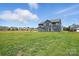 Large backyard with a view of the home's rear exterior at 3214 Mcharney Dr # 34, Harrisburg, NC 28075