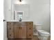 Bathroom featuring modern wood vanity, large mirror, and toilet at 3214 Mcharney Dr # 34, Harrisburg, NC 28075