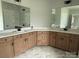 Bathroom features a vanity with double sinks and large mirrors at 3214 Mcharney Dr # 34, Harrisburg, NC 28075