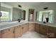 Bathroom with dual sinks, a marble countertop, and modern fixtures at 3214 Mcharney Dr # 34, Harrisburg, NC 28075