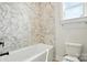 A full bathroom has hexagon tile, a shower and tub combo, and a toilet at 3214 Mcharney Dr # 34, Harrisburg, NC 28075
