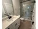 Bathroom features a white vanity, toilet, and a glass-enclosed tiled shower at 3214 Mcharney Dr # 34, Harrisburg, NC 28075