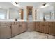 A primary bathroom features double sinks, a vanity, and a large countertop with stylish cabinetry at 3214 Mcharney Dr # 34, Harrisburg, NC 28075