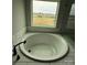 Relaxing bathtub with subway tile accents and a view of the neighborhood at 3214 Mcharney Dr # 34, Harrisburg, NC 28075