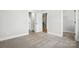 Bedroom with carpeted floor, closet and entry to bathroom at 3214 Mcharney Dr # 34, Harrisburg, NC 28075