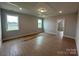 Bright bedroom featuring wood look floors, recessed lighting, and ample windows at 3214 Mcharney Dr # 34, Harrisburg, NC 28075