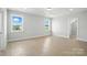 Bedroom showcasing ample natural light, hardwood floors and coffered ceilings at 3214 Mcharney Dr # 34, Harrisburg, NC 28075