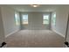 Bright bedroom with neutral carpet, lots of natural light, and trim package at 3214 Mcharney Dr # 34, Harrisburg, NC 28075