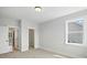 A well-lit bedroom with carpeting, a window, and a closet at 3214 Mcharney Dr # 34, Harrisburg, NC 28075