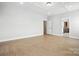 Large bedroom with hardwood floors, recessed lights, and a door to the bathroom at 3214 Mcharney Dr # 34, Harrisburg, NC 28075
