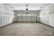 Spacious garage with opener and concrete floor at 3214 Mcharney Dr # 34, Harrisburg, NC 28075