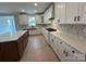Well-equipped kitchen with custom cabinetry, quartz countertops, and stainless steel appliances at 3214 Mcharney Dr # 34, Harrisburg, NC 28075