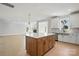 Bright open kitchen with large island, stainless steel appliances, and wood flooring at 3214 Mcharney Dr # 34, Harrisburg, NC 28075