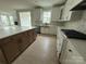 Spacious kitchen featuring granite countertops, modern appliances, and a stylish island at 3214 Mcharney Dr # 34, Harrisburg, NC 28075