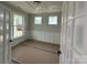 Living room with white walls, wainscoting, and large windows at 3214 Mcharney Dr # 34, Harrisburg, NC 28075