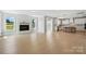 Open-concept living area with fireplace and bright, modern kitchen at 3214 Mcharney Dr # 34, Harrisburg, NC 28075