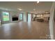 Open floor plan showcasing the spacious living room, dining area, and modern kitchen with an island at 3214 Mcharney Dr # 34, Harrisburg, NC 28075