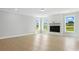 Bright living room with modern fireplace and large windows showcasing outdoor views at 3214 Mcharney Dr # 34, Harrisburg, NC 28075