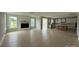 Open-concept living area with fireplace and views of the bright kitchen at 3214 Mcharney Dr # 34, Harrisburg, NC 28075