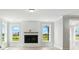 Bright living room features modern fireplace and abundant natural light at 3214 Mcharney Dr # 34, Harrisburg, NC 28075