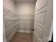 Walk-in pantry featuring metal shelving with ample storage space at 3214 Mcharney Dr # 34, Harrisburg, NC 28075