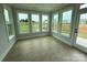 Bright sunroom featuring large windows overlooking the backyard at 3214 Mcharney Dr # 34, Harrisburg, NC 28075