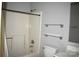 This bathroom features a shower-tub combo, toilet, glass shelving and a vanity with a sink and mirror at 331 Eastwood Dr, Salisbury, NC 28146