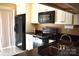 Kitchen features stainless steel appliances, dark countertops, and white cabinets at 331 Eastwood Dr, Salisbury, NC 28146