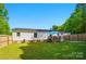 Spacious backyard featuring a well-maintained lawn, and a fenced perimeter at 3678 Old Camden Hwy, Heath Springs, SC 29058