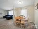 Bright dining area view with a round table and laminate flooring at 3678 Old Camden Hwy, Heath Springs, SC 29058
