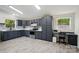 Charming kitchen with modern appliances, custom backsplash, desk area and laminate flooring at 3678 Old Camden Hwy, Heath Springs, SC 29058
