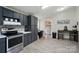 Cozy kitchen leads to laundry area, showcasing modern appliances and a functional layout at 3678 Old Camden Hwy, Heath Springs, SC 29058