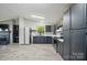 Spacious open kitchen with updated appliances, tile backsplash, and adjacent living area at 3678 Old Camden Hwy, Heath Springs, SC 29058