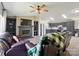 The cozy living area and kitchen features a brick fireplace and comfortable leather seating at 3678 Old Camden Hwy, Heath Springs, SC 29058