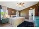 Main bedroom featuring brown walls, bright natural light and entry to the ensuite bath at 3678 Old Camden Hwy, Heath Springs, SC 29058