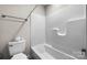 Bright white bathroom features toilet, bathtub and shower at 3722 Windy Pine Nw Ln, Hickory, NC 28601