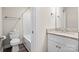 Bright bathroom featuring a granite vanity and white cabinet and bath-tub combo at 3722 Windy Pine Nw Ln, Hickory, NC 28601