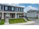 Well-maintained townhome exterior with stone accents, covered porch, and manicured lawn at 3722 Windy Pine Nw Ln, Hickory, NC 28601