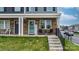 Charming front porch with stone accents, seating, and well-maintained lawn at 3722 Windy Pine Nw Ln, Hickory, NC 28601