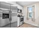 Galley kitchen features stainless steel appliances and wood-look flooring at 3722 Windy Pine Nw Ln, Hickory, NC 28601